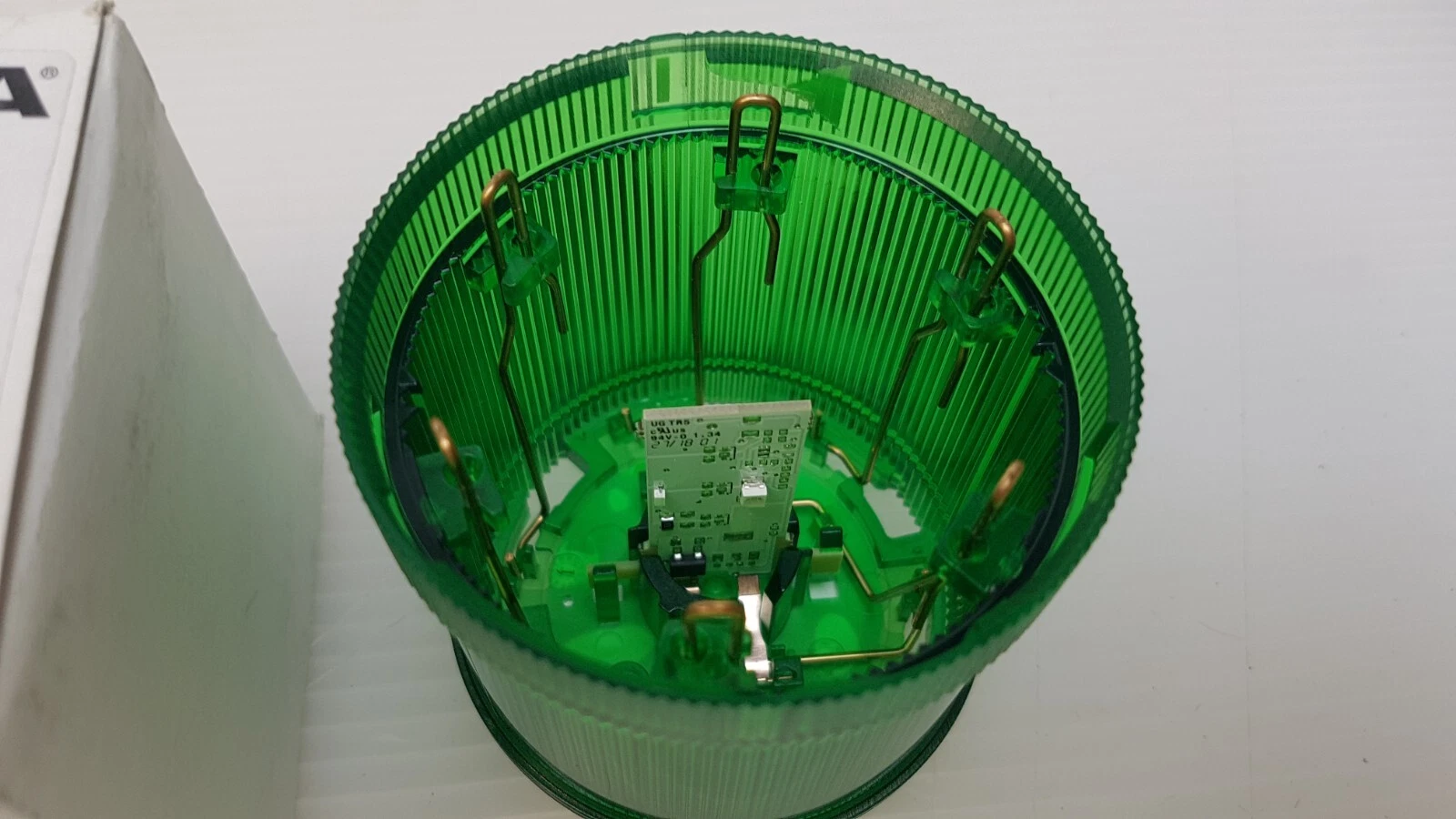 Inside the WERMA KombiSIGN 71 green element: LED board and contact pins