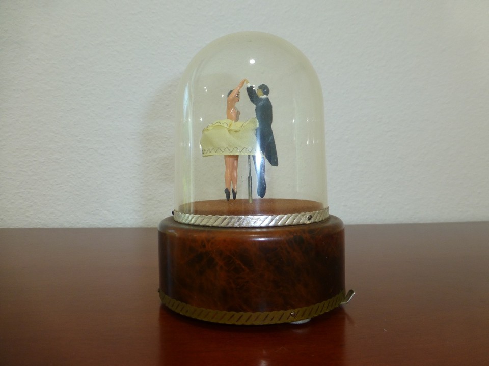 A Reuge automaton music box with a dancing ballerina couple — Reuge is THE Swiss luxury music box brand and automata are genuinely rare finds.