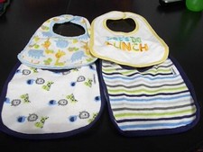 FOUR NEW BABY BIBS TWO GERBER WITH PLASTIC BACKING