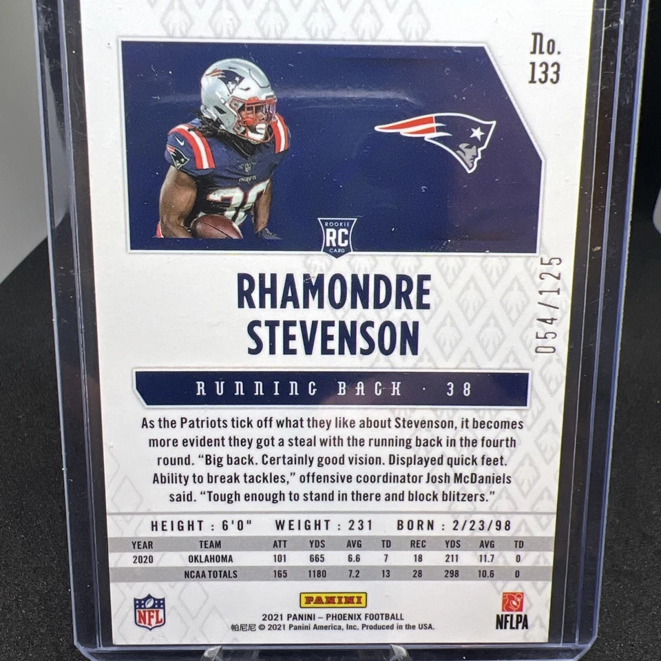 2021 Panini Phoenix #133 Purple Rhamondre Stevenson Patriots #/125 Rookie - Image 2 of 3