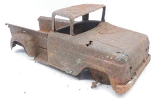Rusty Metal that used to be a 1958-1959 Tonka Stepside Pickup Truck