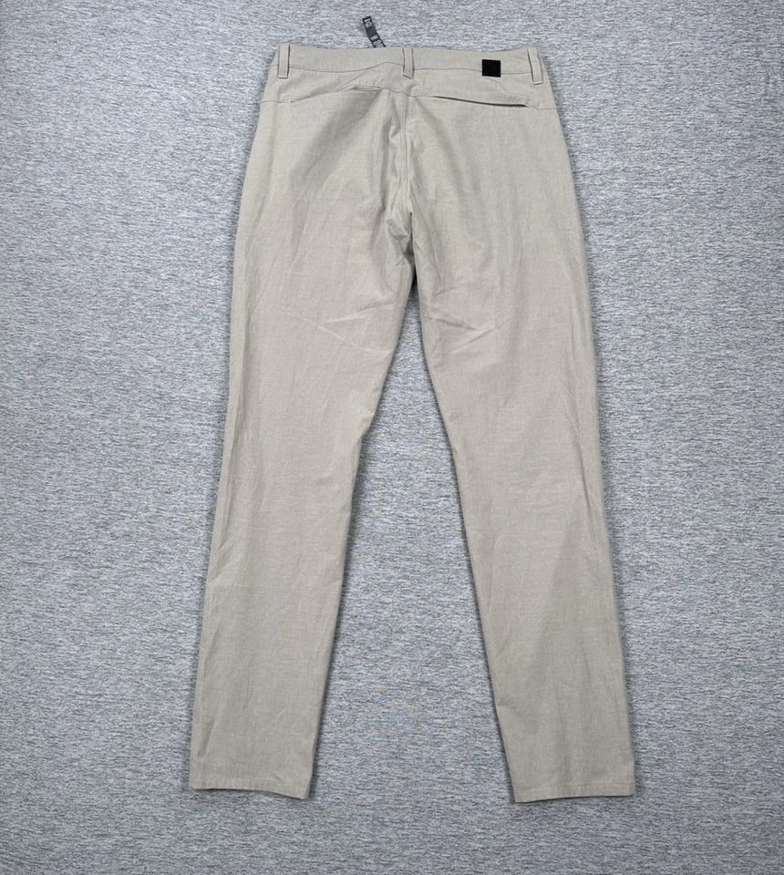 Pantalones chinos Vuori para hombre 30x32 beige objetivo rendimiento elástico viaje ciudad golf Foto 2 de 4