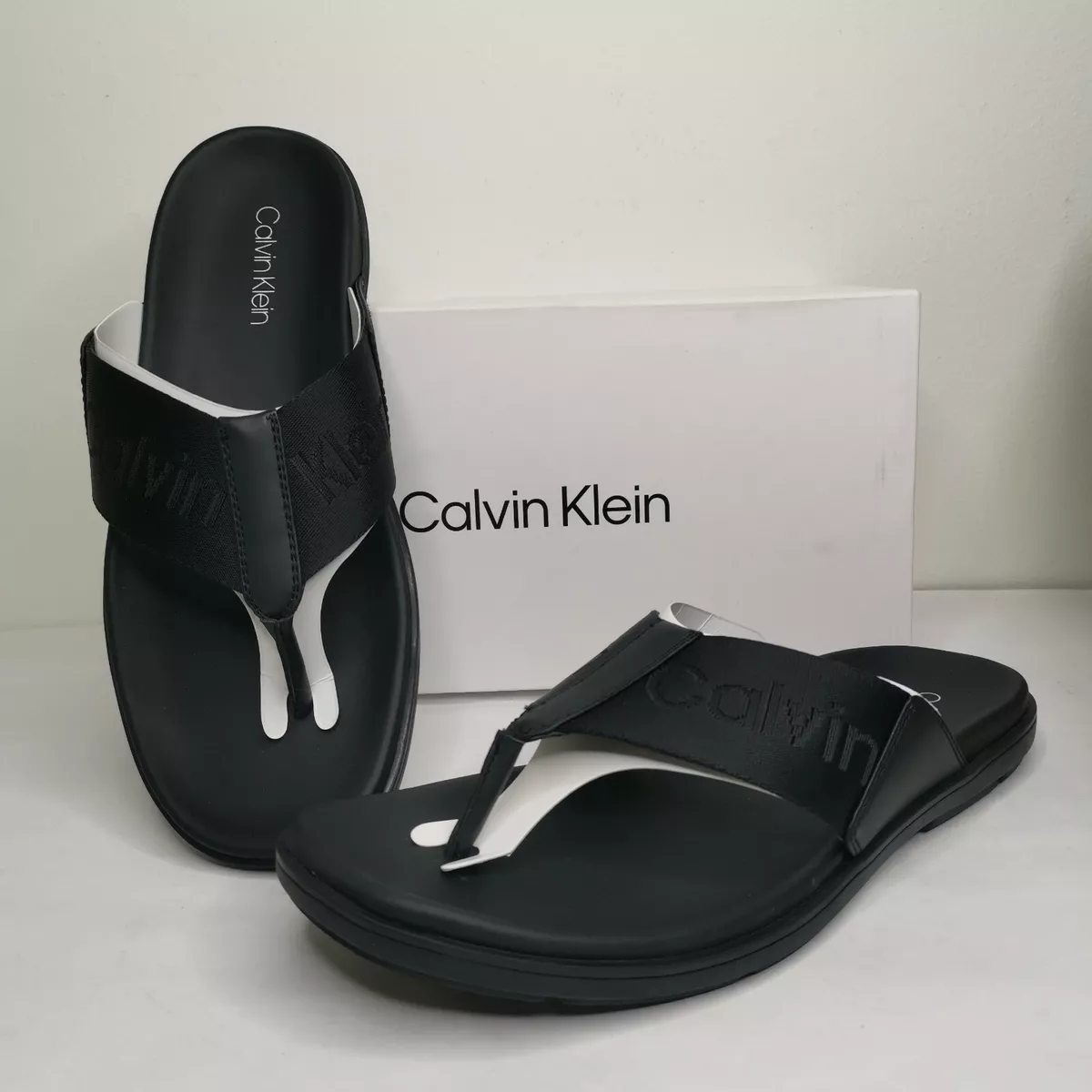 Buy Calvin Klein Men Solid Thong Flip Flops With Brand Logo Applique Detail  - Flip Flops for Men 23362530 | Myntra