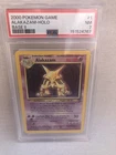 PSA 7 Pokemon WOTC 2000 Base Set 2 Alakazam 1/130 Holo Rare Card NM