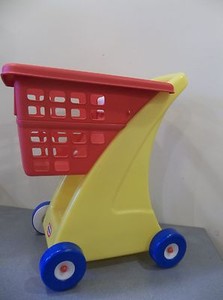 toy shopping cart with doll seat