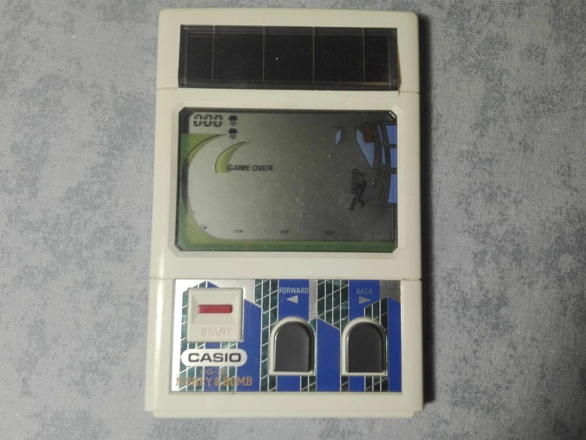 Jeu électronique Casio Oncle Charumera Myojo 1982 – LCD Solar Handheld Retro