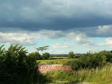 PHOTO  REDLANDS  FLYING SCHOOL WANBOROUGH  A LIGHT PLANE TAKES OFF WITH SEVERAL