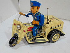 POLICE THREE WHEEL MOTORCYCLE-BATTEY OPERATED- TIN-MADE N JAPAN-WORK-
