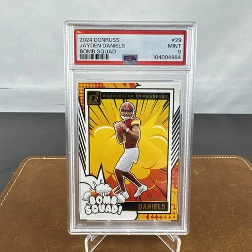 MT 9 RC 2024 PANINI DONRUSS BOMB SQUAD #29 JAYDEN DANIELS ROOKIE RC PSA 9
