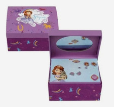 A set of three pairs of jewelry with a purple jewelry box.