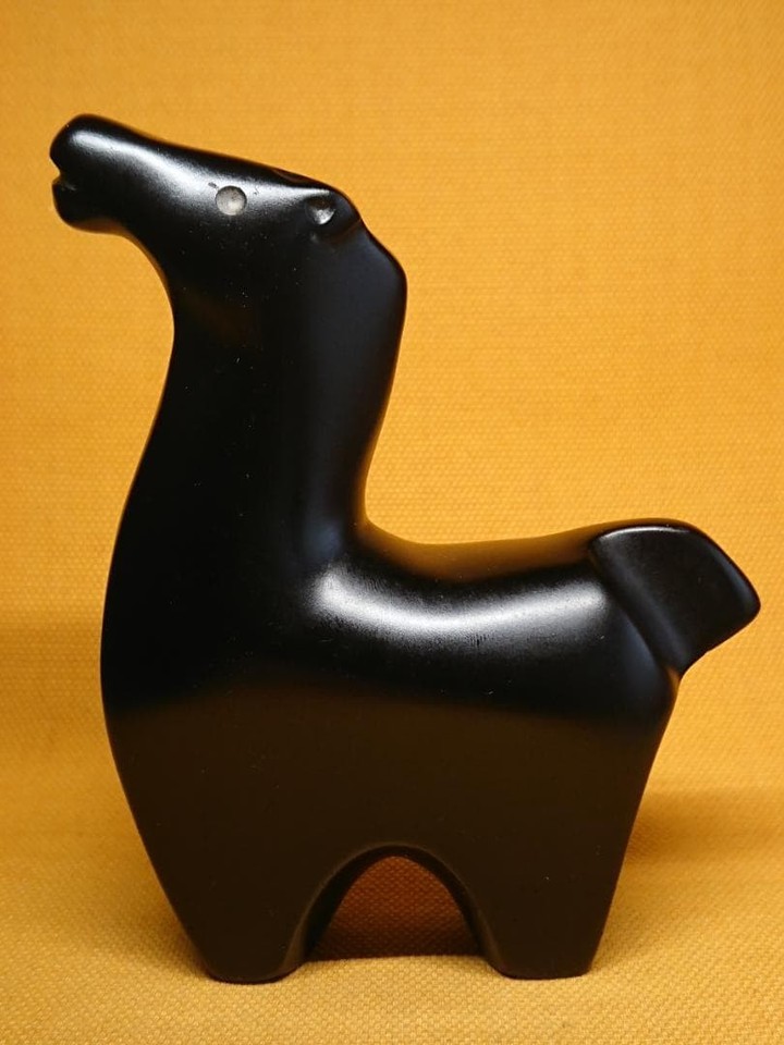A weighty, vintage stone horse figurine with the kind of gravitas and presence that plastic trinkets will never have.