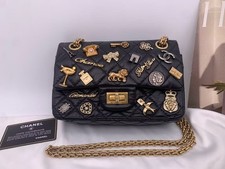 Chanel 2.55 Reissue 225 Small Lucky Charms Black Aged Calfskin Gold Authentic