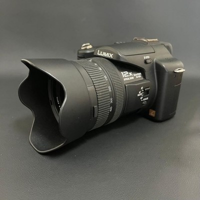 Panasonic LUMIX DMC-FZ50 Camera with Leica Lens and Smartphone