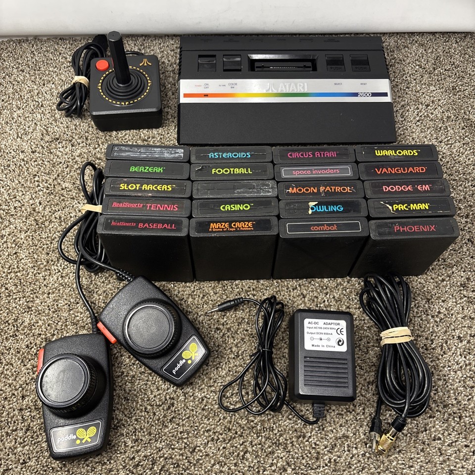 A tested Atari 2600 Jr bundle with 20 games, joystick, AND paddles — the full analog childhood experience in one box.