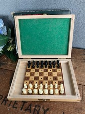 Vintage John Jacques/Staunton traveling pegged chess set in wood case.
