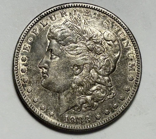 1883 S MORGAN DOLLAR AU