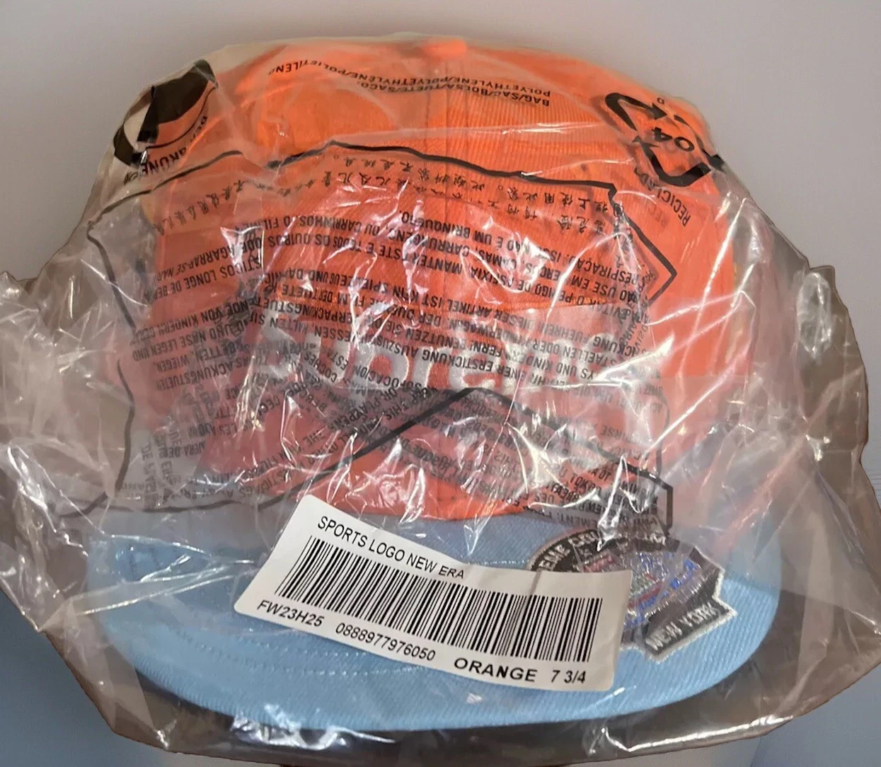 BOITE CHAMPIONNATS SUPRÊMES LOGO NOUVELLE ÉPOQUE CHAPEAU ORANGE TAILLE 7 3/4 FW23 NEUF/AUTHENTIQUE