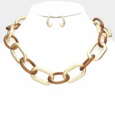Pierced matte gold and brown link necklace and earring set
