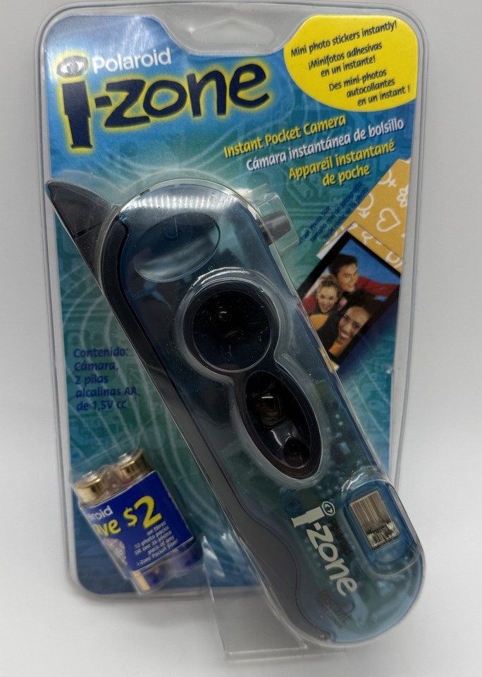 A sealed, never-opened Y2K-era Polaroid i-Zone pocket camera in electric blue — a tiny time capsule from peak early-2000s nostalgia.