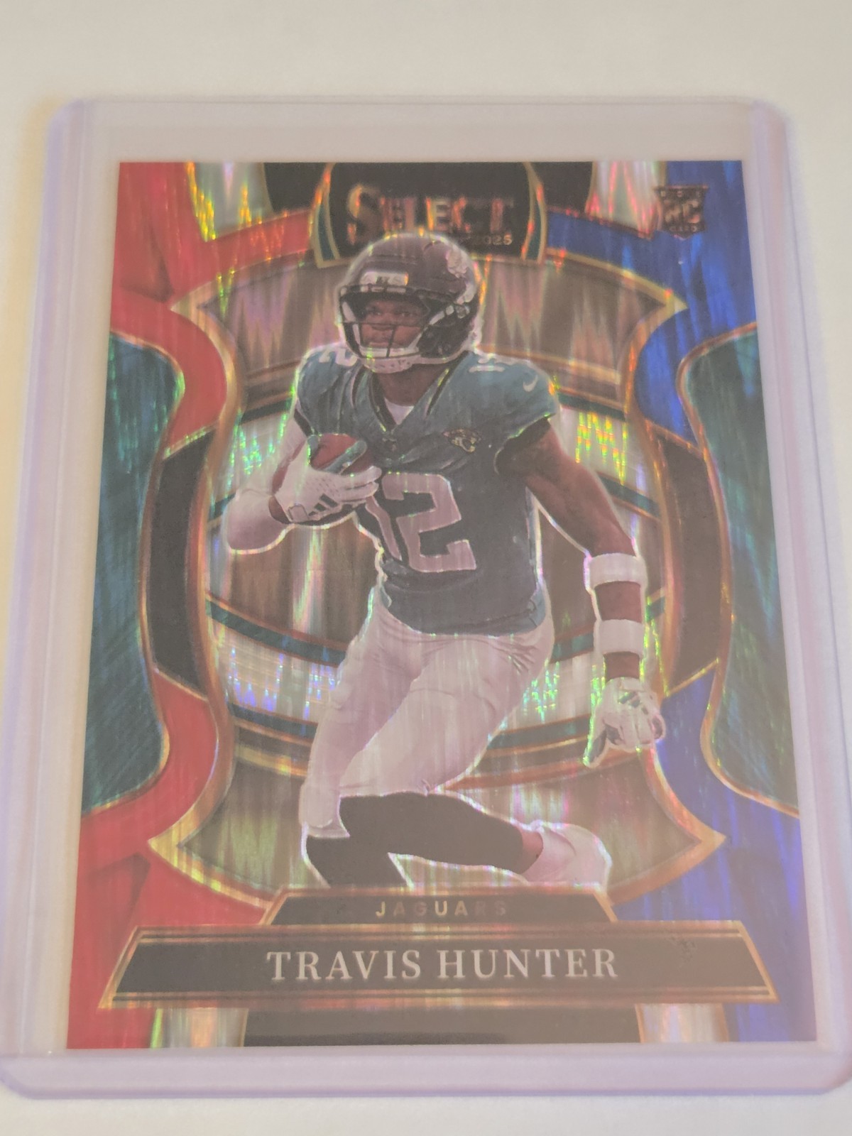 2025 Panini Select Travis Hunter (RC) #28 Red And Blue Prizm Shock Jaguars