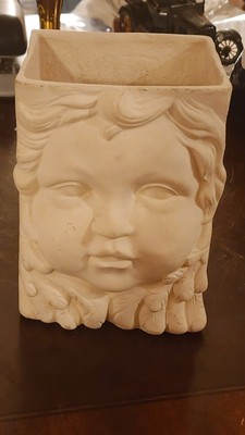 475.  White Bisque Bag Rectangular Vase with Child's Face