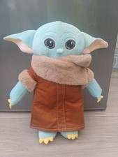 Baby Yoda plush toy from the Star Wars series The Mandalorian.
