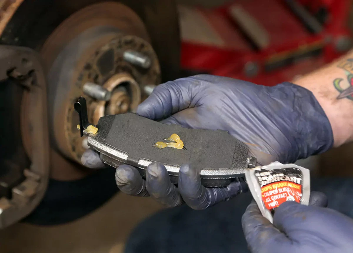 Greasing the brake with lubricant.
