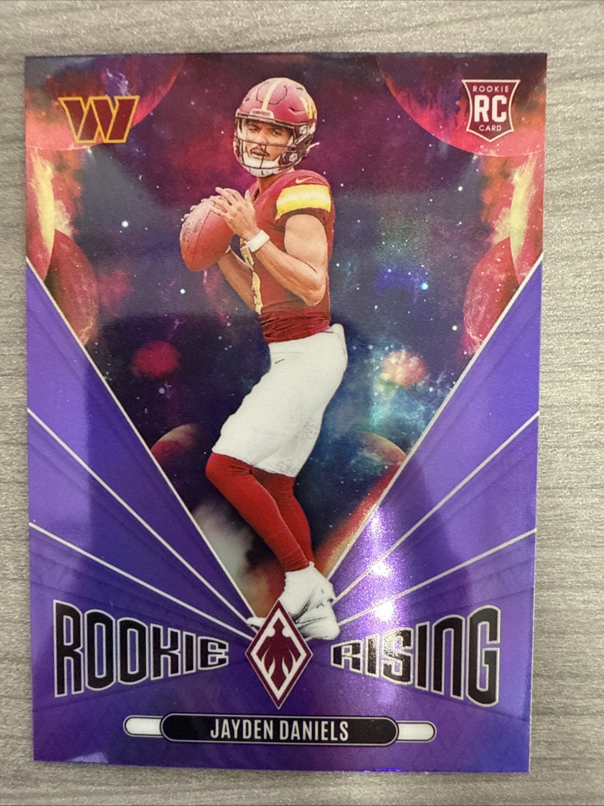 2024 Panini Phoenix Jayden Daniels Rookie Rising Purple Holo RC #RR-JDS