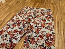 Damen vintage Hose mit orangenen Blumen Print | Esmara Slim Fit High Waist Jeans