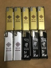 Lighter Set of 10 Gold Silver Black Hotel Varian Resort Hotel Petit Bali