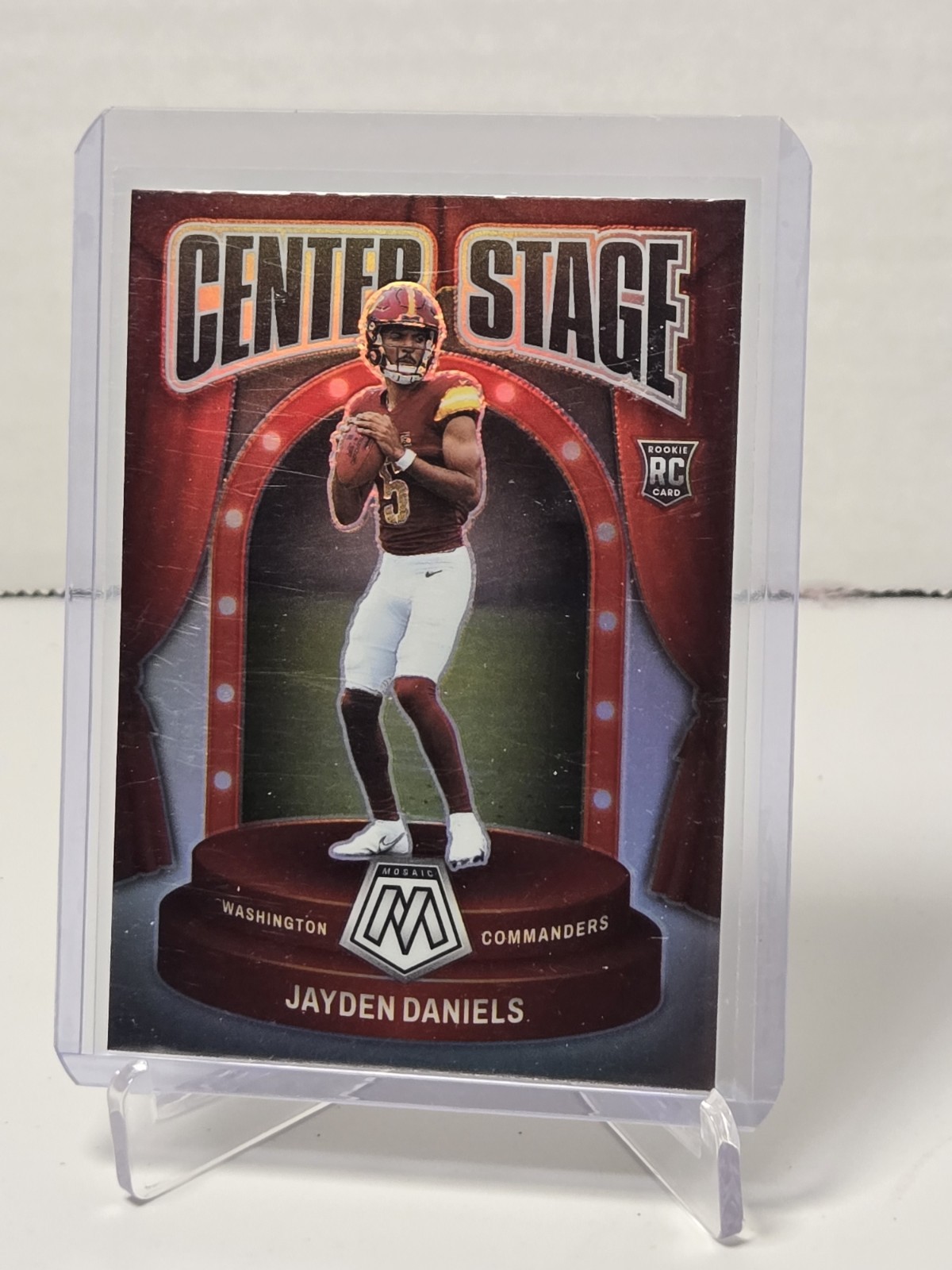 2024 Panini Mosaic - Center Stage Jayden Daniels #8 Silver Prizm (RC) Commanders