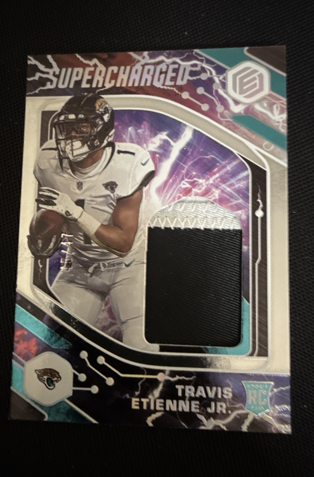 2021 Panini Elements - Supercharged Travis Etienne #SCH-TET /199 (MEM, RC)