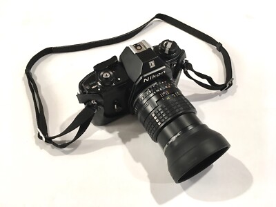Nikon EM SLR Camera with Nikon Series E 100mm 1:2.8 lens and Accessories