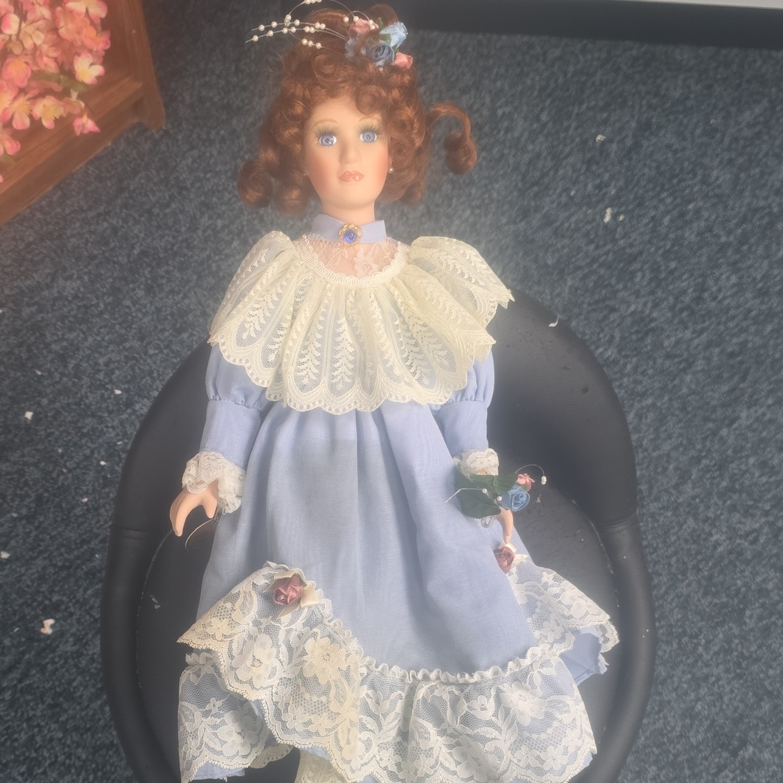 Porcelain Doll Girl with Curly Brown Hair, Blue Lace Dress, Decorative Hat