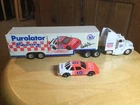 Pre Owned VINTAGE NASCAR PUROLATOR  RACING DIE CAST CAR, CAB W/ TRAILER. #10.