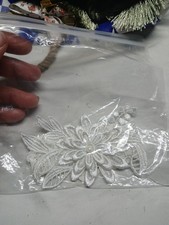 white lace bridal garter with a floral and pearl accent. Handmade