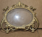 Vintage Victorian-style ornate brass footed mirror featuring intricate floral — photo 1
