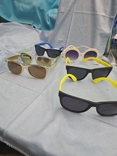 Lot of 6 sunglasses prioned, slight scratches.
