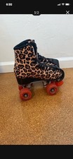 Roller skates, impala, red wheels and cheetah print