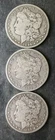 1896 O, 1896 O, and 1899 O $1 Morgan Silver Dollars