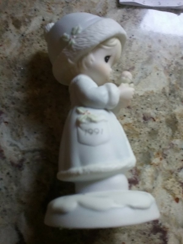Precious Moments Figurine " May Your Christmas Be Merry".  Dated 1991 on Front