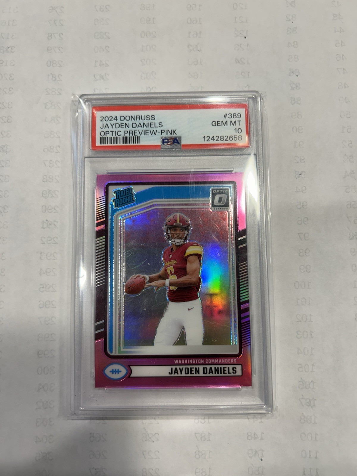 2024 Panini Donruss - Rated Rookie Jayden Daniels #389 Optic Preview Pink PSA 10 view 1