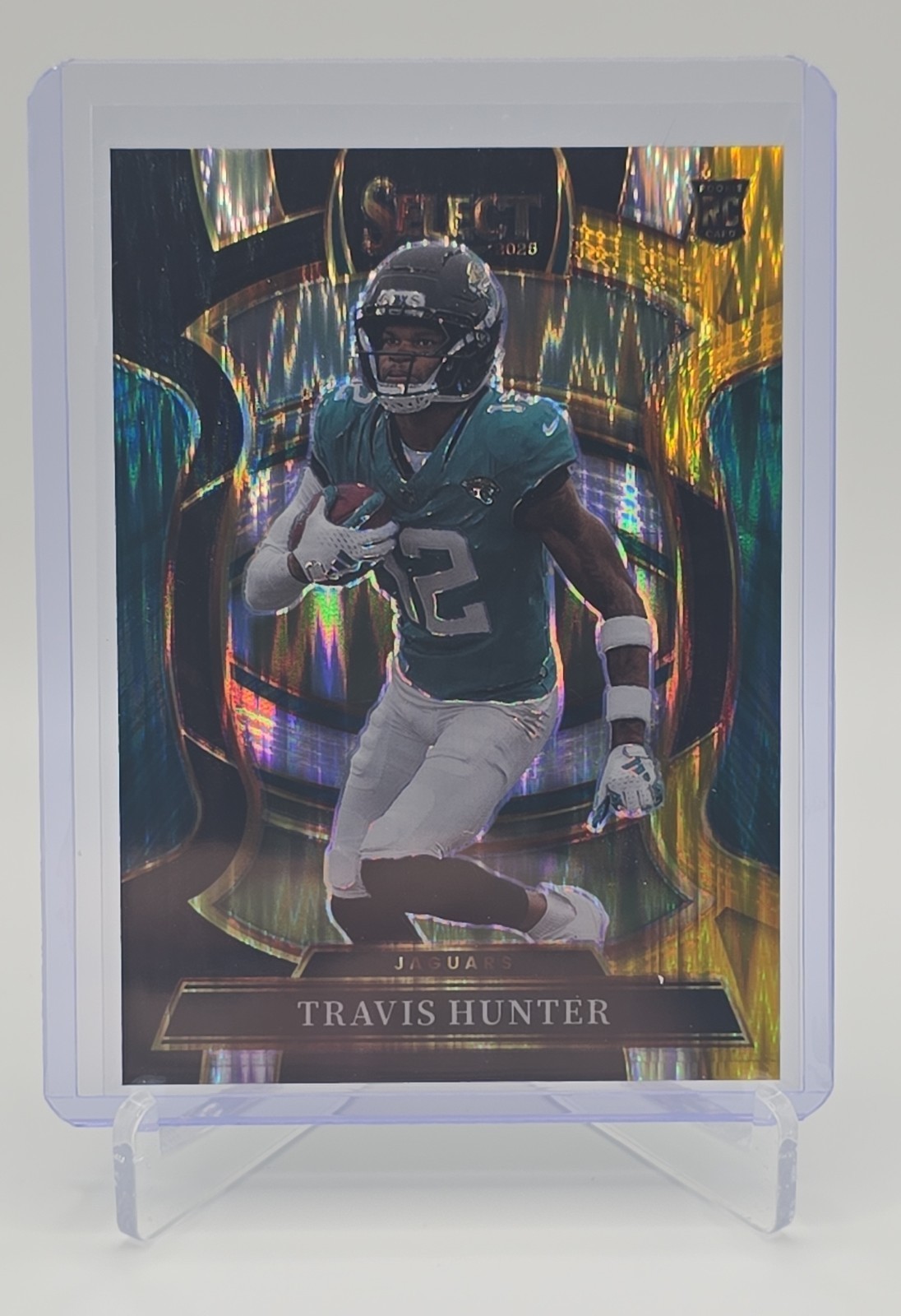 2025 Panini Select - Concourse Travis Hunter #28 Black & Gold Shock Prizm (RC)
