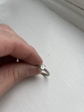 Solitaire diamond platinum 0.43ct emerald cut. plain tapered shoulder