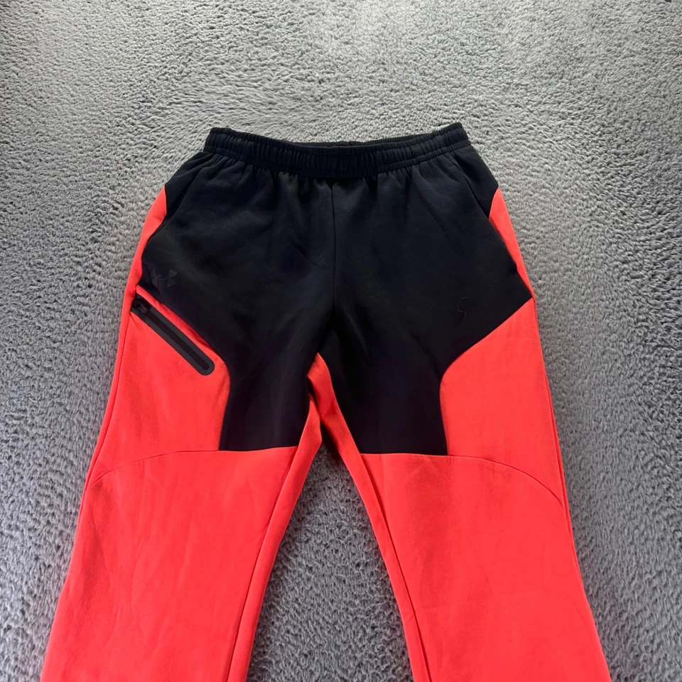 Pantalones deportivos Under Armour para hombre medianos naranja poliéster elástico ajuste cónico Foto 2 de 4