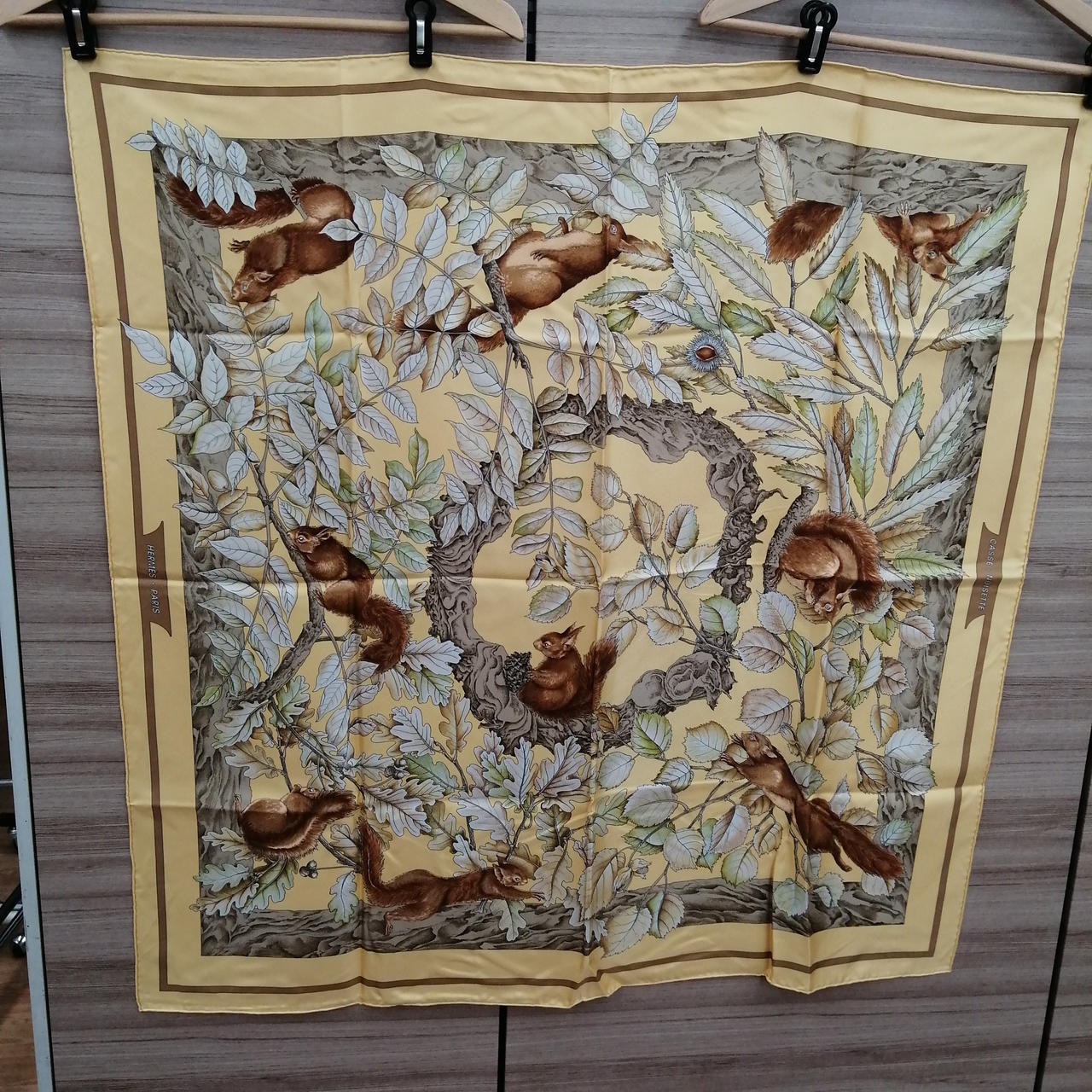 Luxury Hermes silk scarf with iconic designer prints