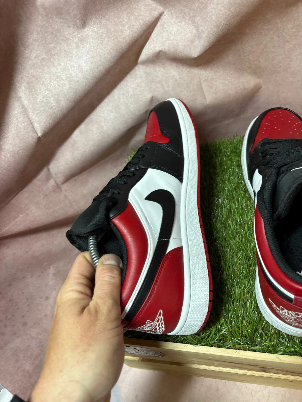Nike Air Jordan 1 Low Bred Toe Mens Trainers in a black, red, and white image 6