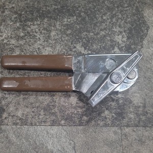 vintage brown handle Swing a way can opener