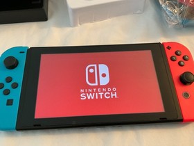 Nintendo Switch Console with Neon Blue and Neon Red Joy Cons with Extras