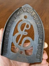Antique Sad Flat Iron Trivet ENTERPRISE MFG CO PHILA USA Cast Iron Holder VTG